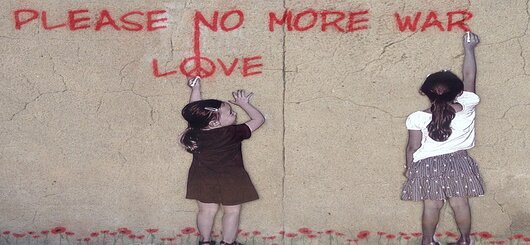 Straßenkunst: Graffiti zum Thema Frieden