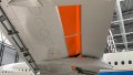 Die Spalte beim Ausfahren der Spoiler wurde mit einem Blech überdeckt, die Abstrahlung des Schalls faktisch eliminiert.